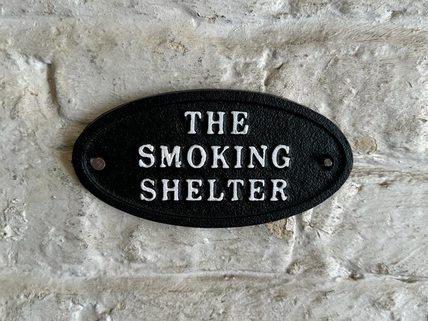 the smoking shelter sign